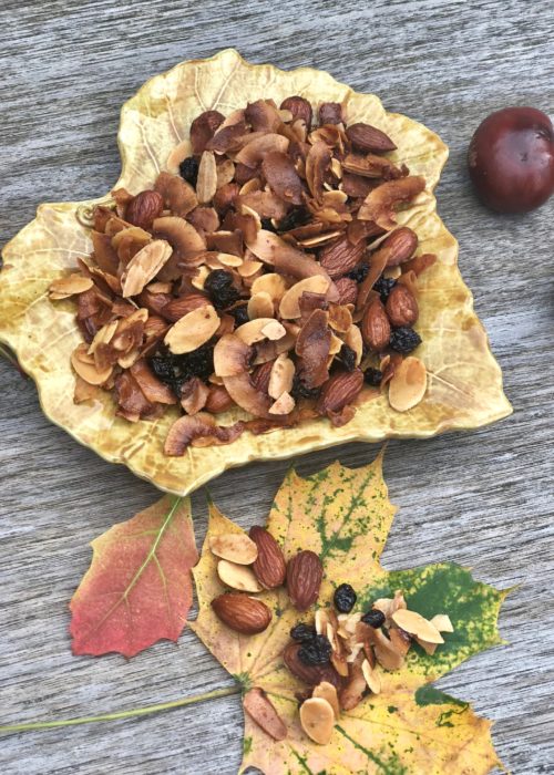 Crunchy bits for autumn cravings! yellow plate on table with leaves and chestnut